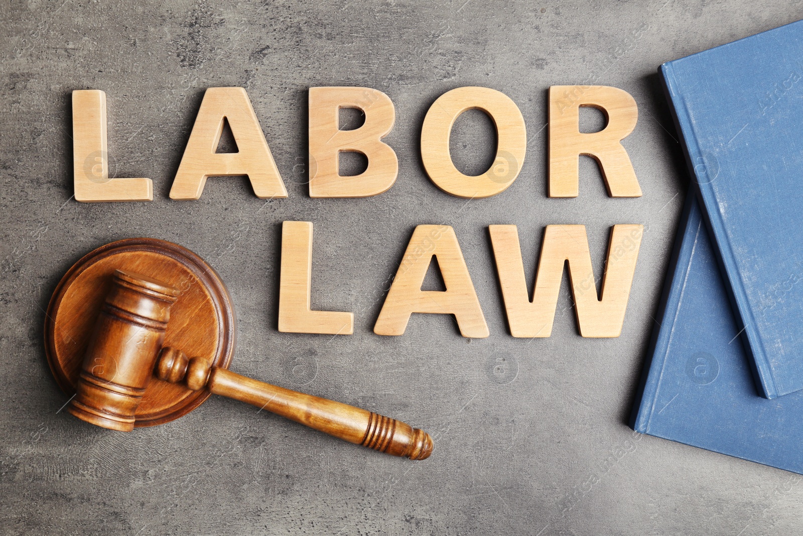 Photo of Flat lay composition with words LABOR LAW on grey background