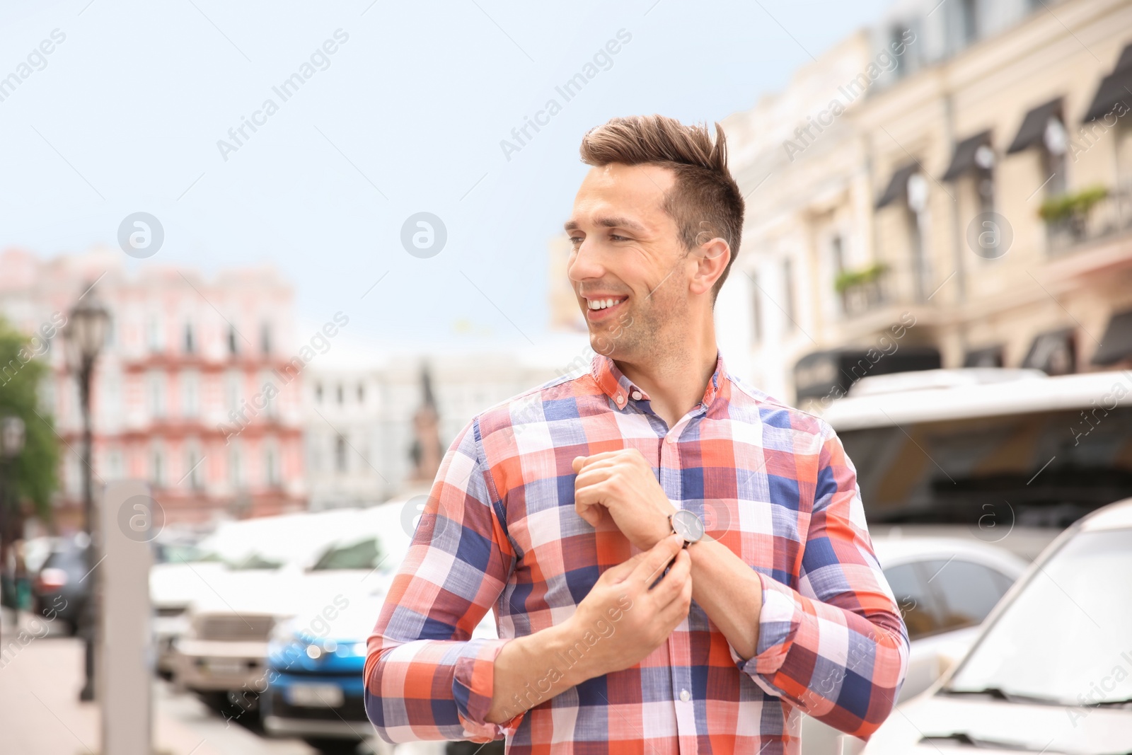 Photo of Portrait of attractive young man in stylish outfit outdoors