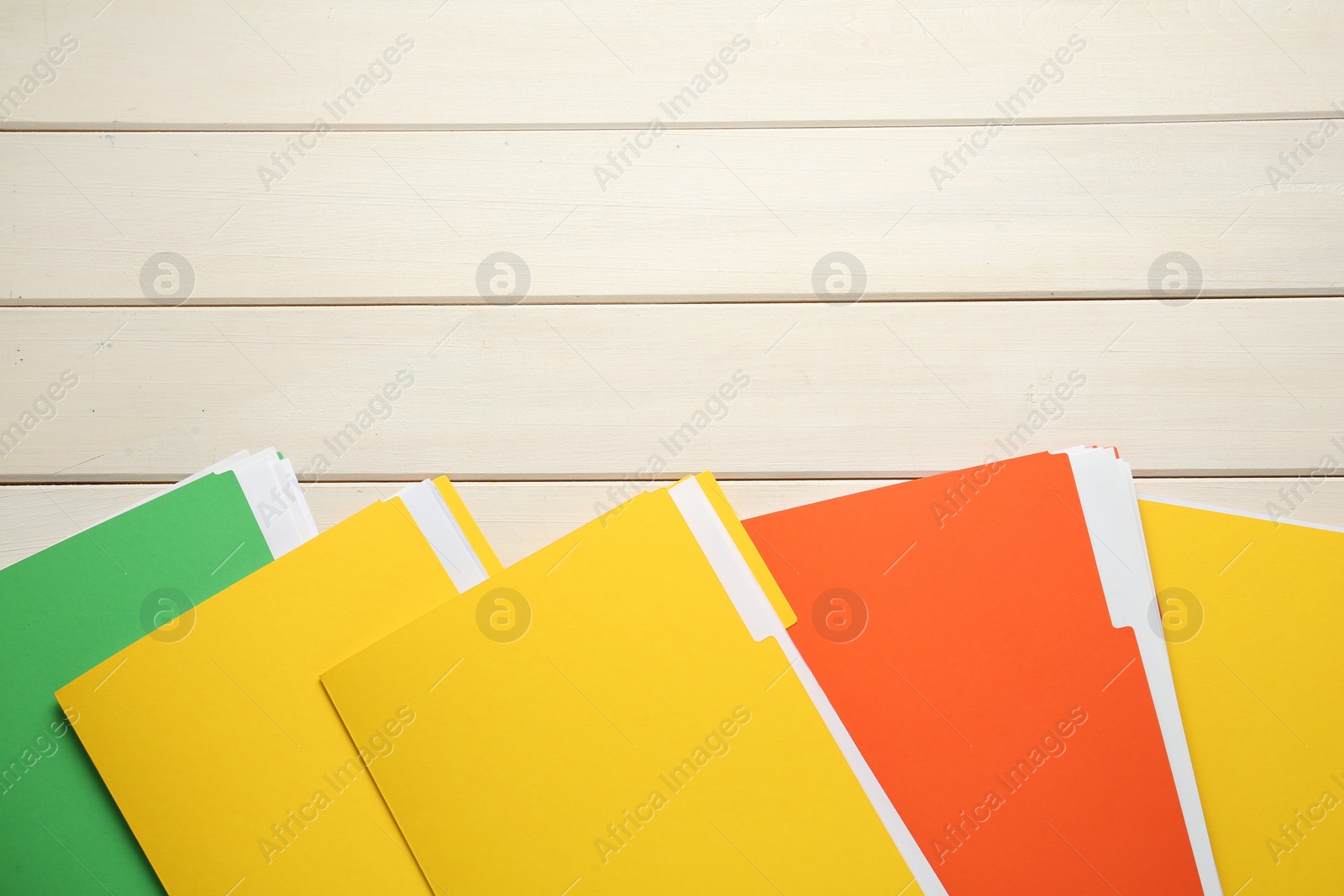 Photo of Different files with documents on white wooden table, flat lay. Space for text