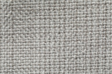 Texture of soft light grey fabric as background, top view