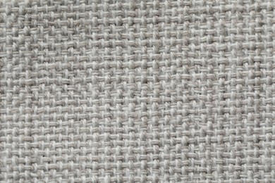 Photo of Texture of soft light grey fabric as background, top view