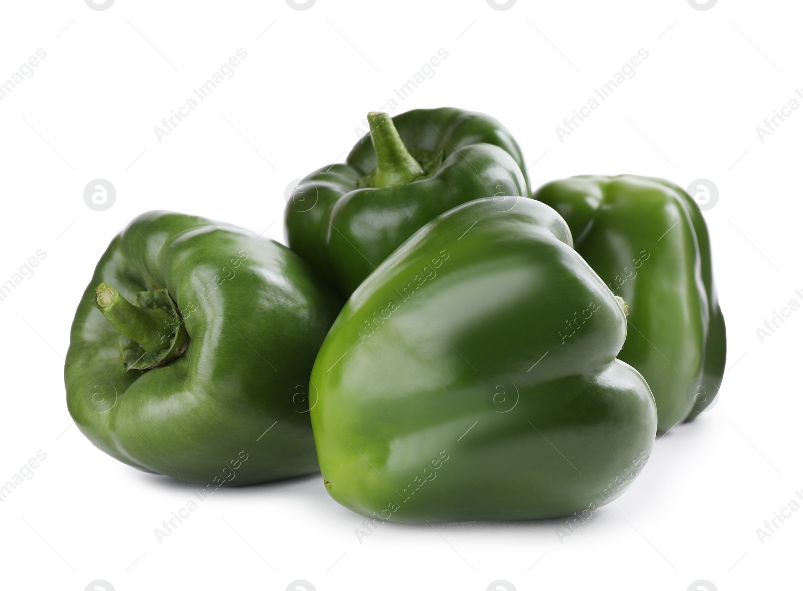 Photo of Ripe green bell peppers isolated on white