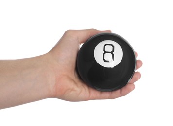 Man holding magic eight ball on white background, closeup