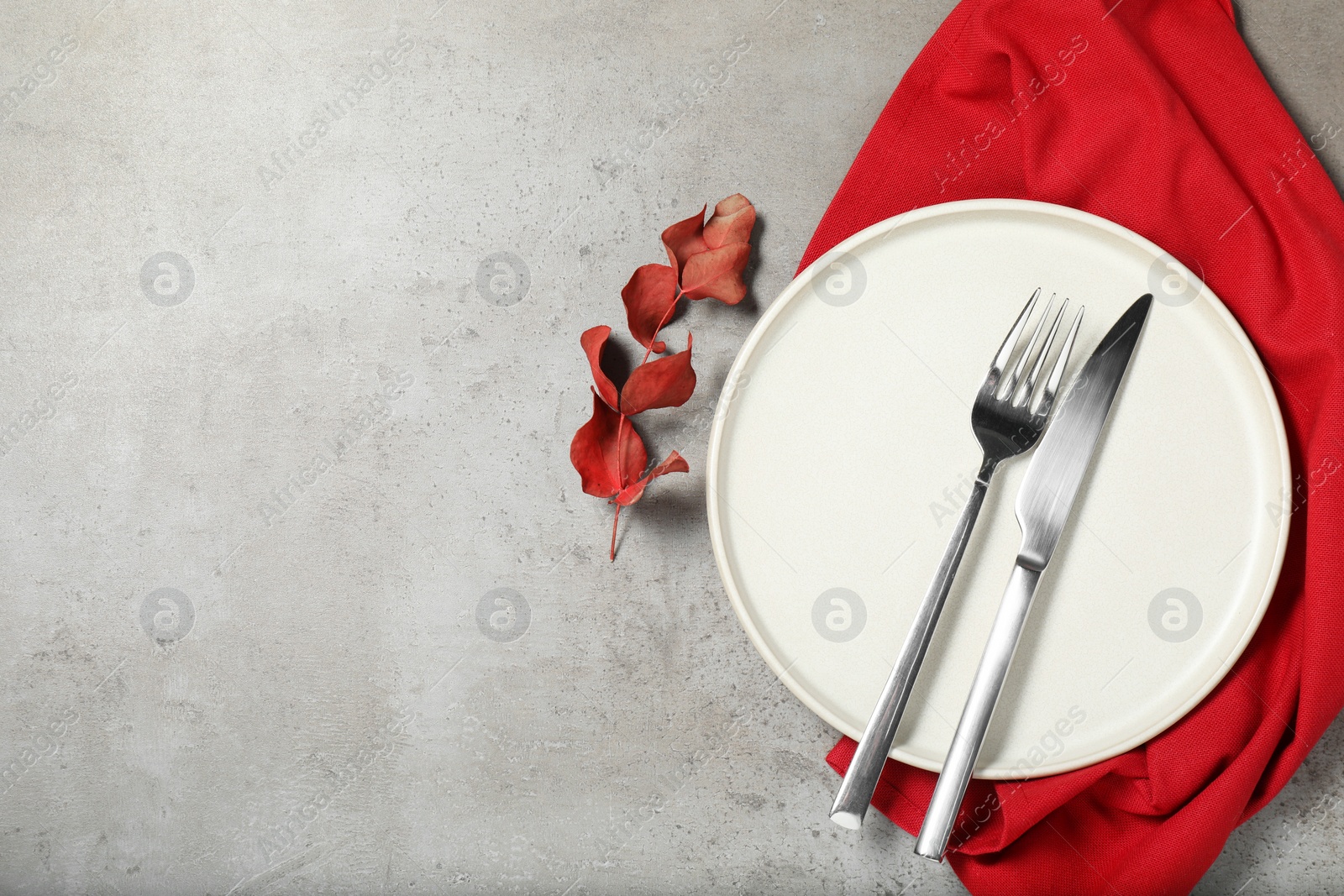 Photo of Setting with beautiful cutlery on textured table, top view. Space for text