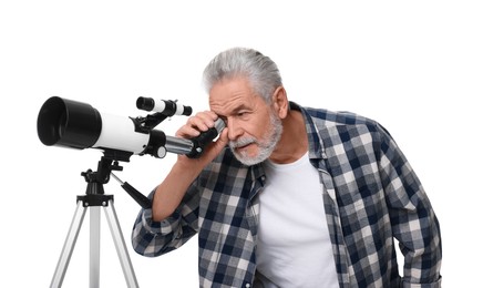 Senior astronomer looking at stars through telescope on white background