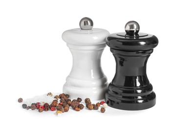 Photo of Two shakers with pepper and salt isolated on white