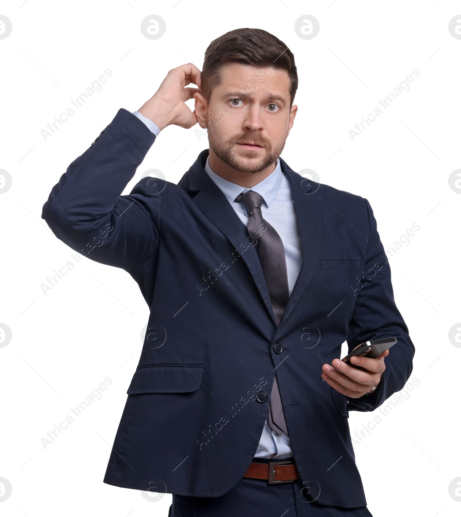 Photo of Handsome bearded businessman in suit using smartphone on white background