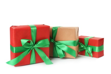 Different beautifully wrapped gift boxes on white background