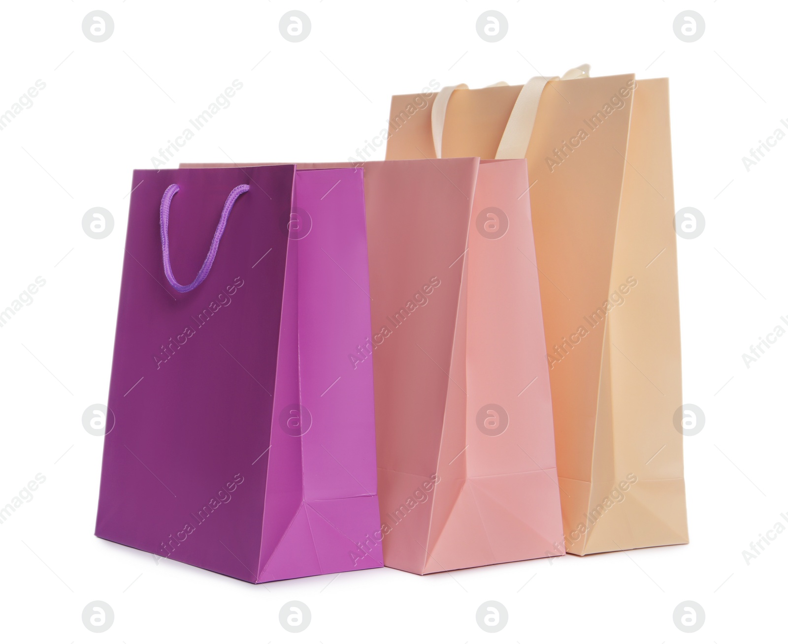 Photo of Colorful paper shopping bags isolated on white