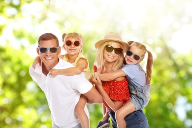 Image of Happy family with children outdoors on sunny day