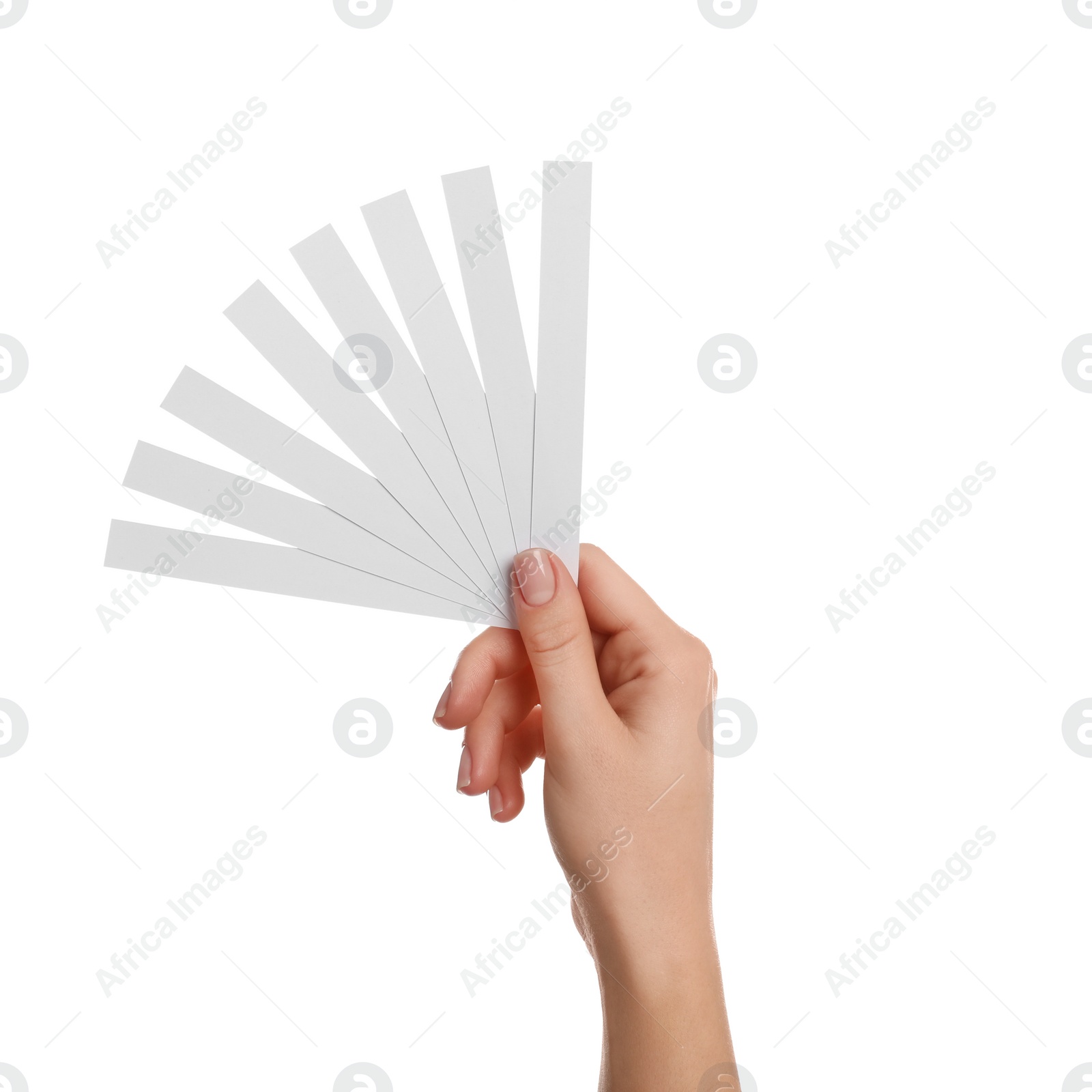 Photo of Woman holding perfume testing strips on white background, closeup