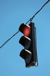 View of traffic light against blue sky