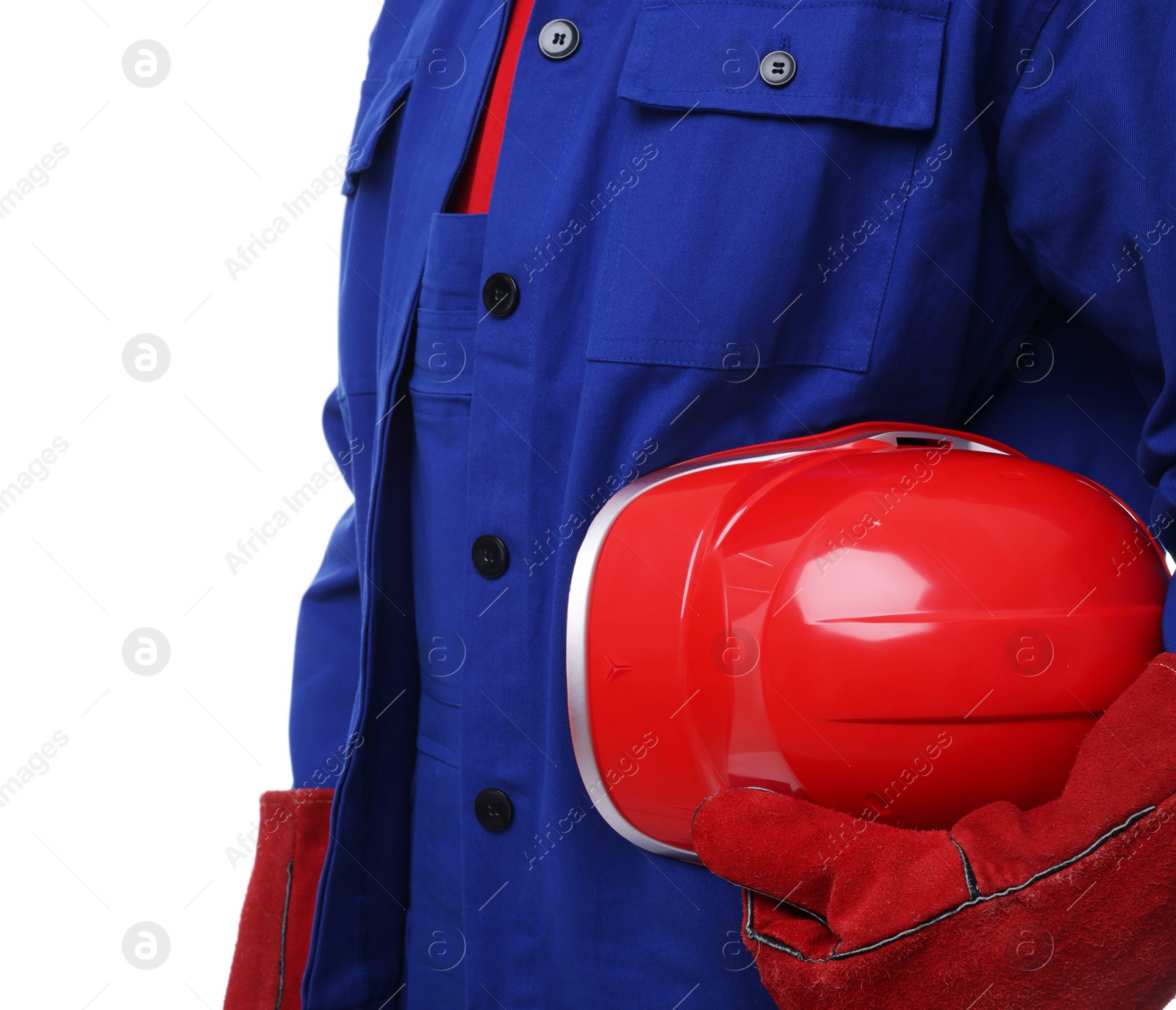 Photo of Young man holding red hardhat on white background, closeup. Safety equipment