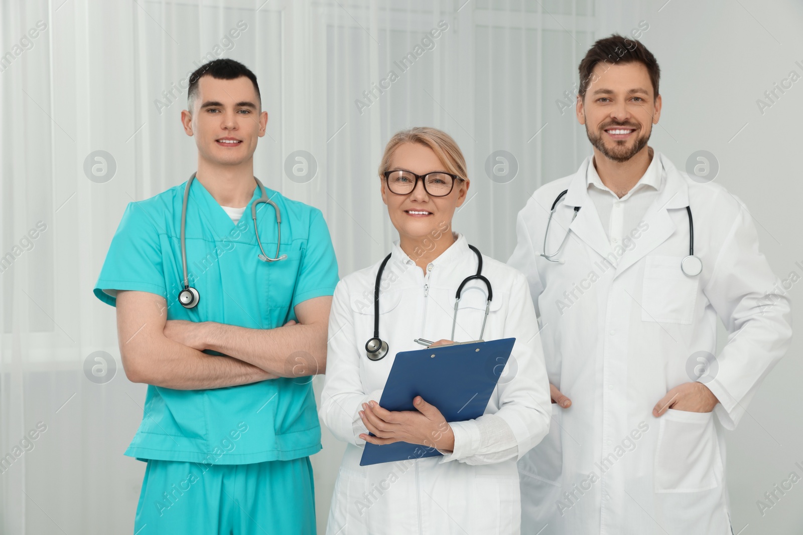 Photo of Portrait of medical doctors wearing uniforms indoors