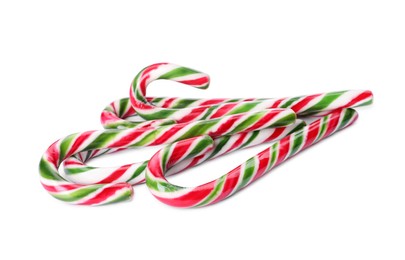 Sweet Christmas candy canes on white background