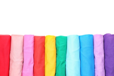 Photo of Colorful collection of t-shirts on white background