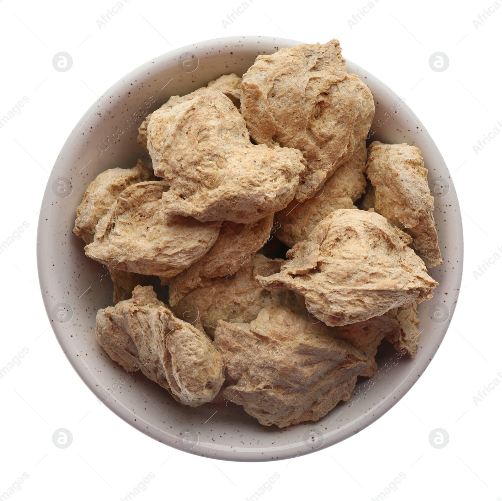 Photo of Dehydrated soy meat chunks in bowl on white background, top view