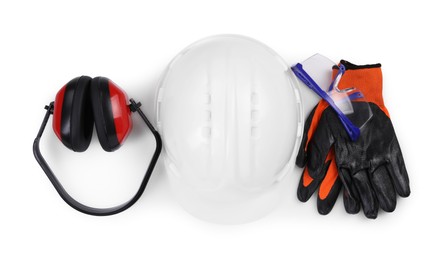 Photo of Hard hat, earmuffs, gloves and goggles isolated on white, top view. Safety equipment
