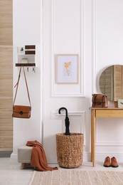 Modern hallway interior with stylish dressing table and key holder