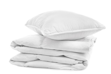 Photo of Soft blanket with pillow on white background