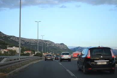 Photo of Trogir, Croatia - September 24, 2023: Picturesque view of highway with cars and mountains