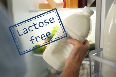 Image of Man with gallon of lactose free milk near refrigerator indoors, closeup