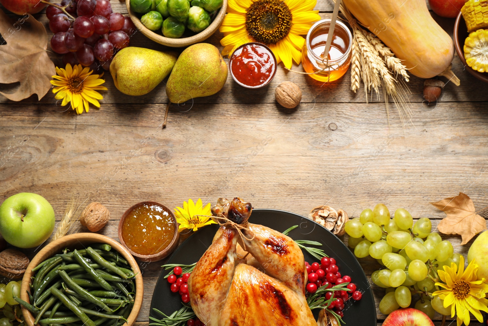 Photo of Flat lay composition with turkey on wooden background, space for text. Happy Thanksgiving day