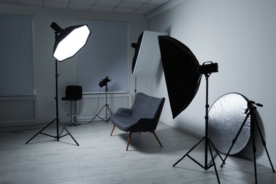 Photo of Modern photo studio with professional lighting equipment