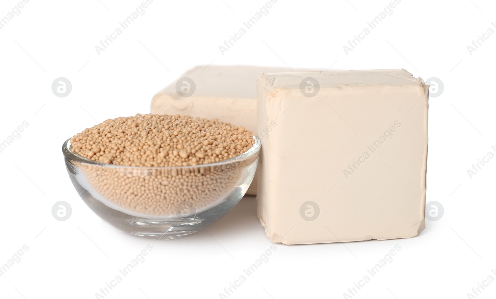 Photo of Compressed and granulated yeast on white background