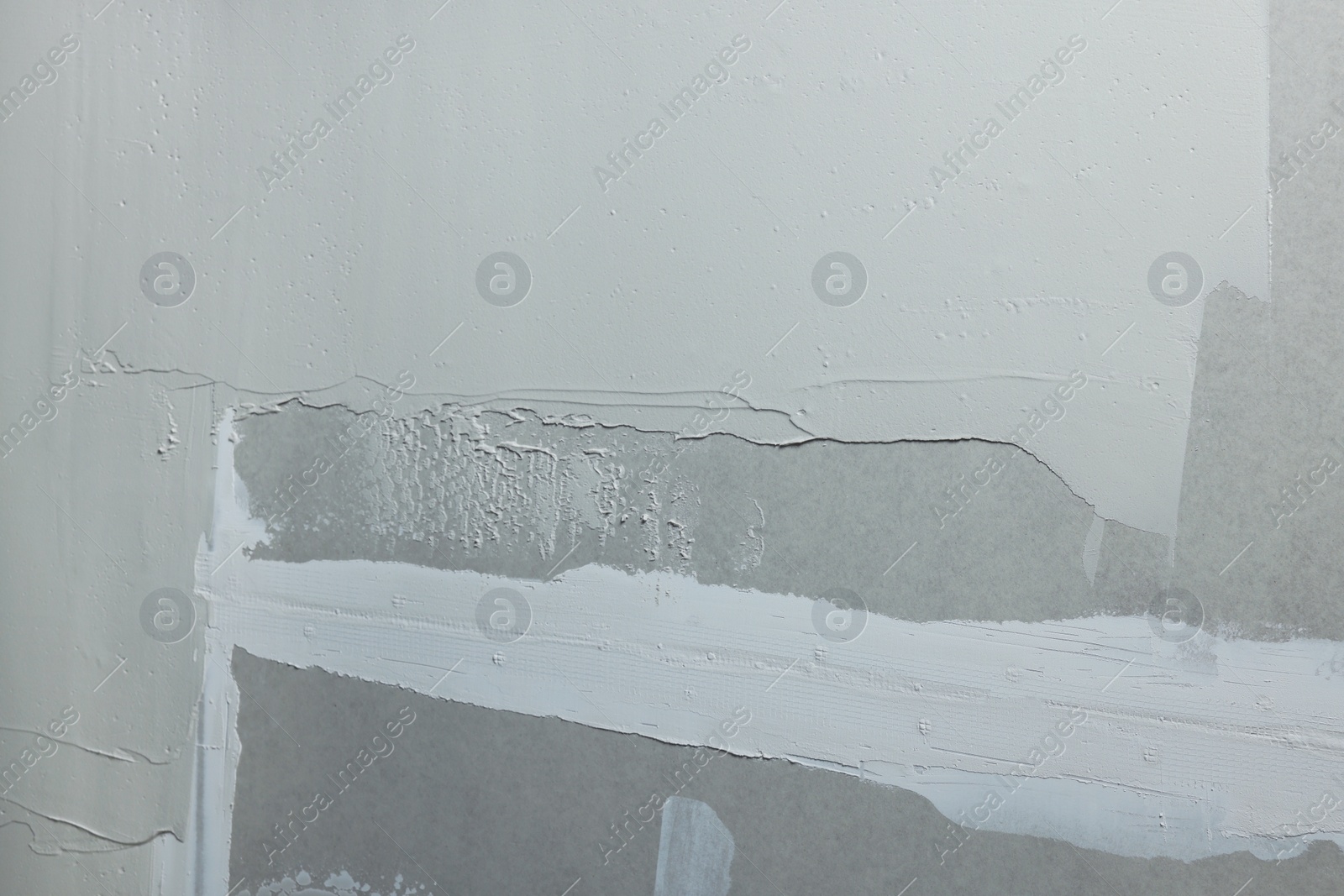 Photo of Wall covered with plaster as background, closeup