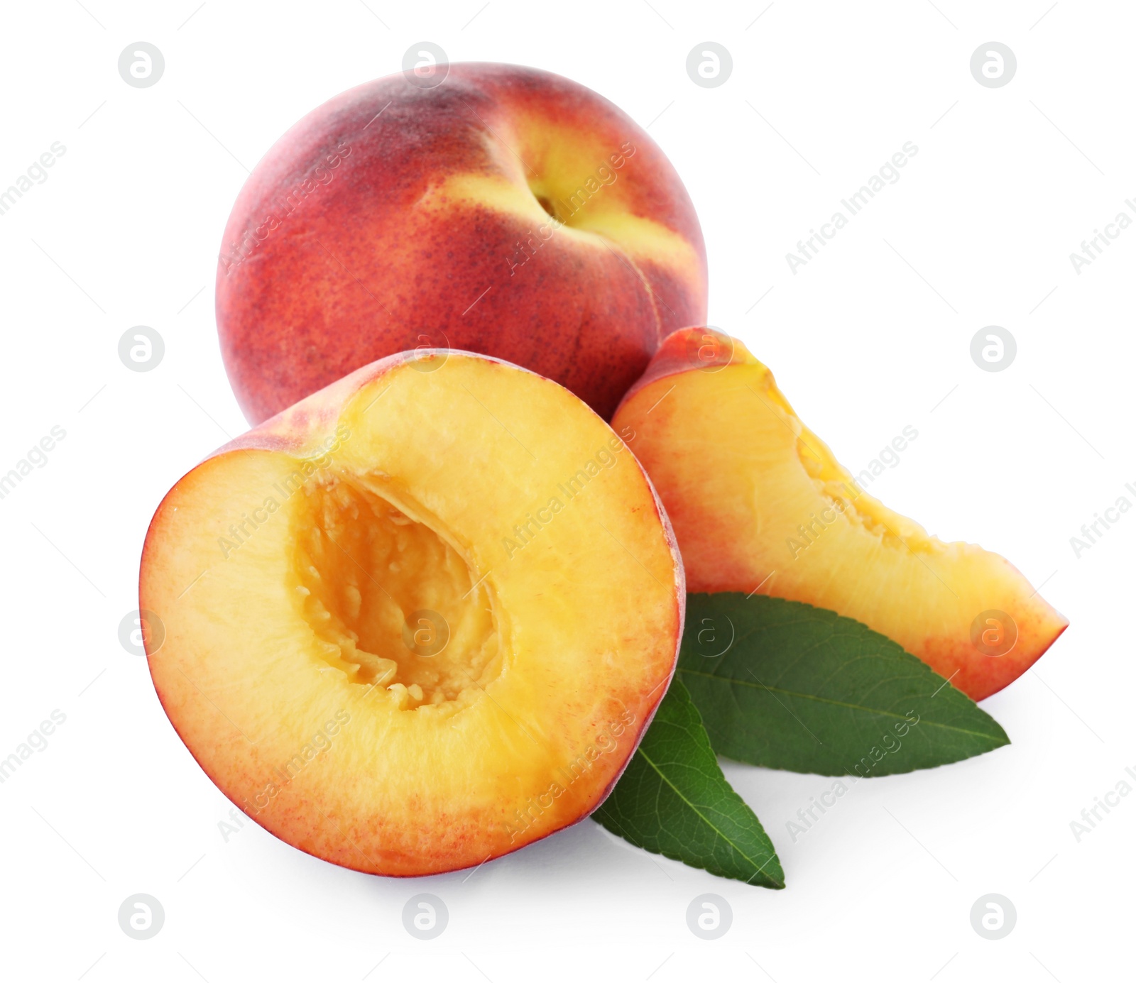 Photo of Sweet juicy peaches with leaves on white background