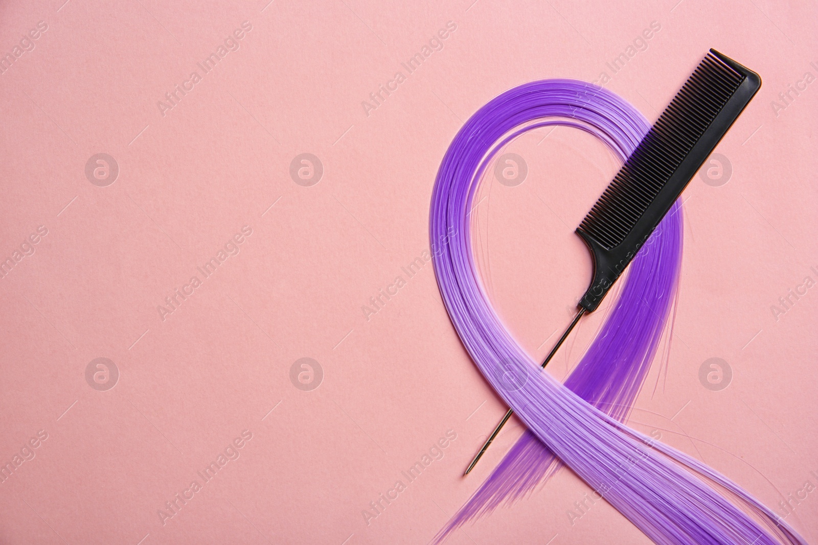 Photo of Flat lay composition with strand of hair and comb on color background. Space for text