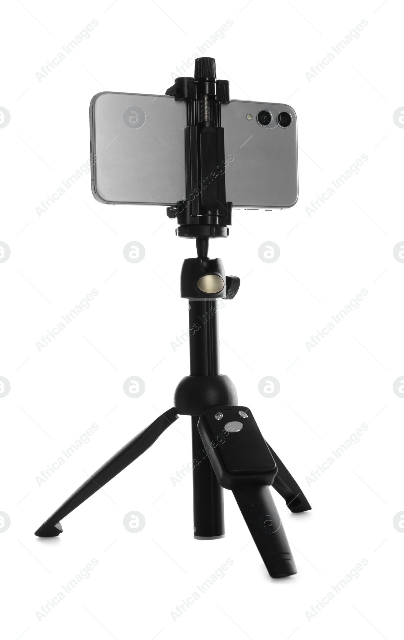 Photo of Smartphone fixed to tripod on white background