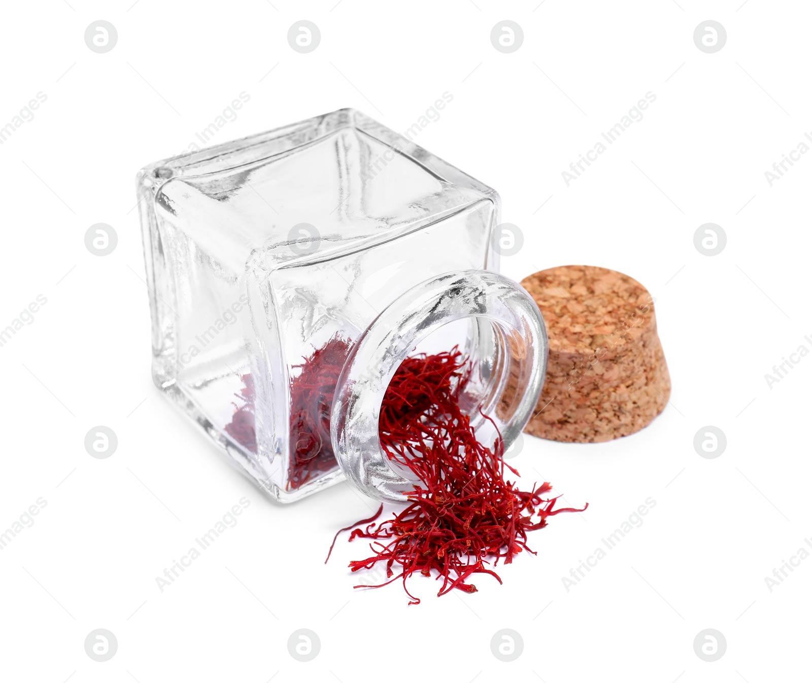 Photo of Aromatic saffron and glass jar isolated on white