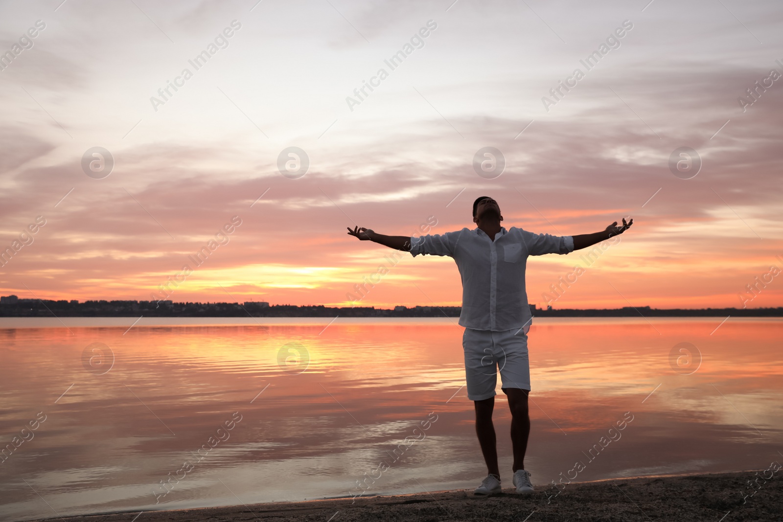 Photo of Man near river at sunset, space for text. Nature healing power