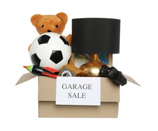 Photo of Sign Garage Sale written on box with different stuff isolated on white