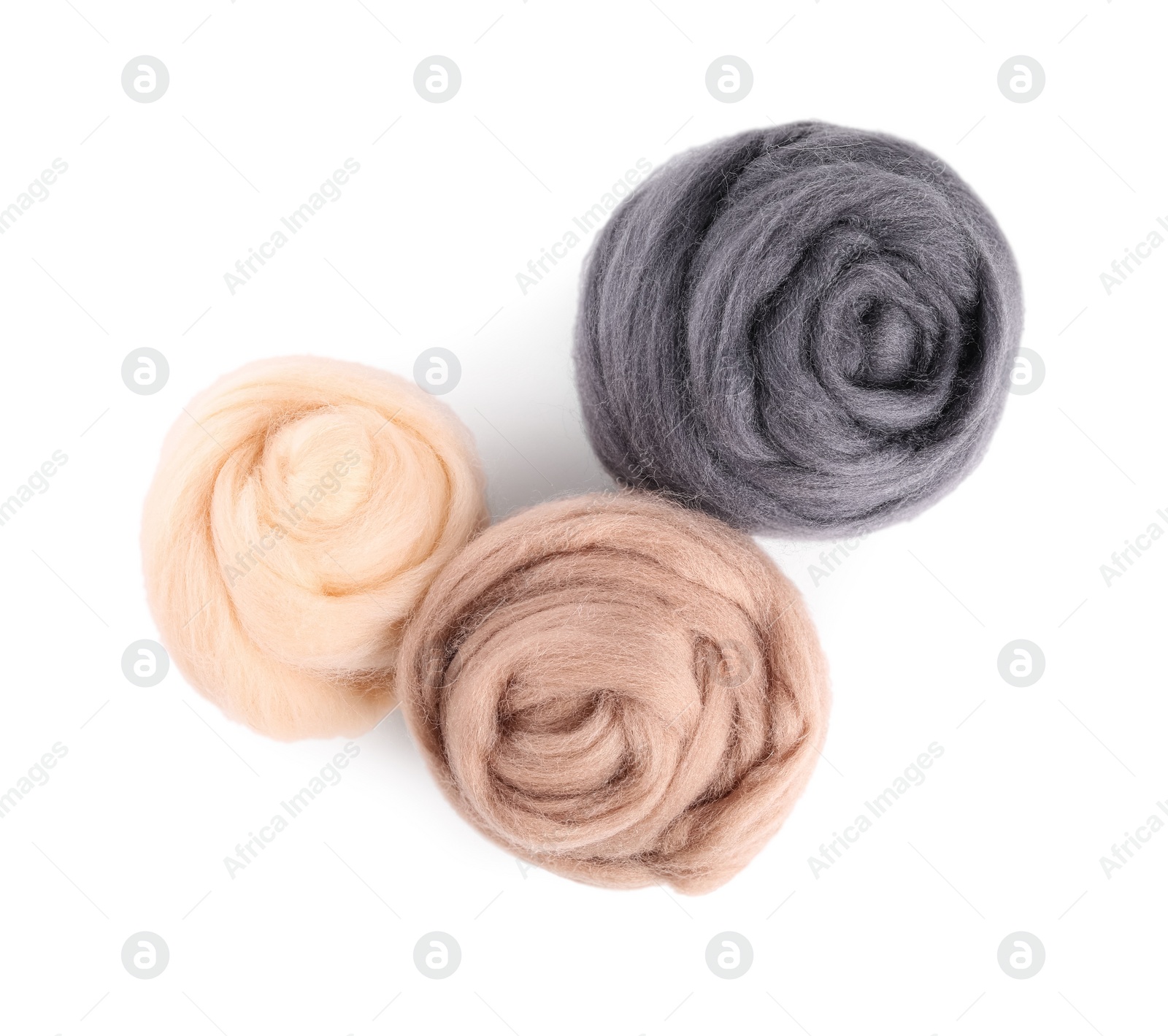 Photo of Beige and grey felting wool isolated on white, top view