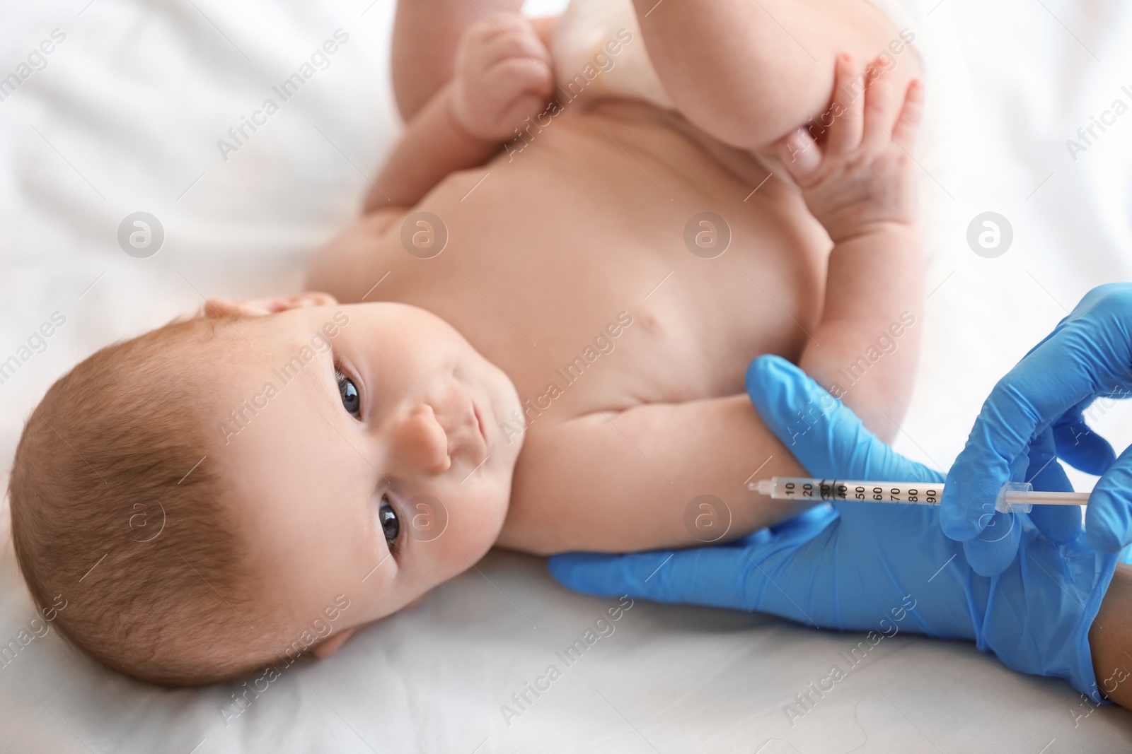 Photo of Doctor vaccinating baby in clinic