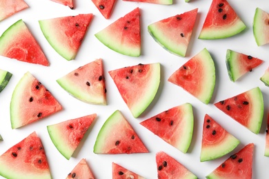 Flat lay composition with slices of watermelon on white background