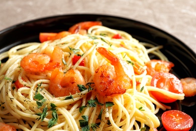 Delicious pasta with shrimps on plate, closeup