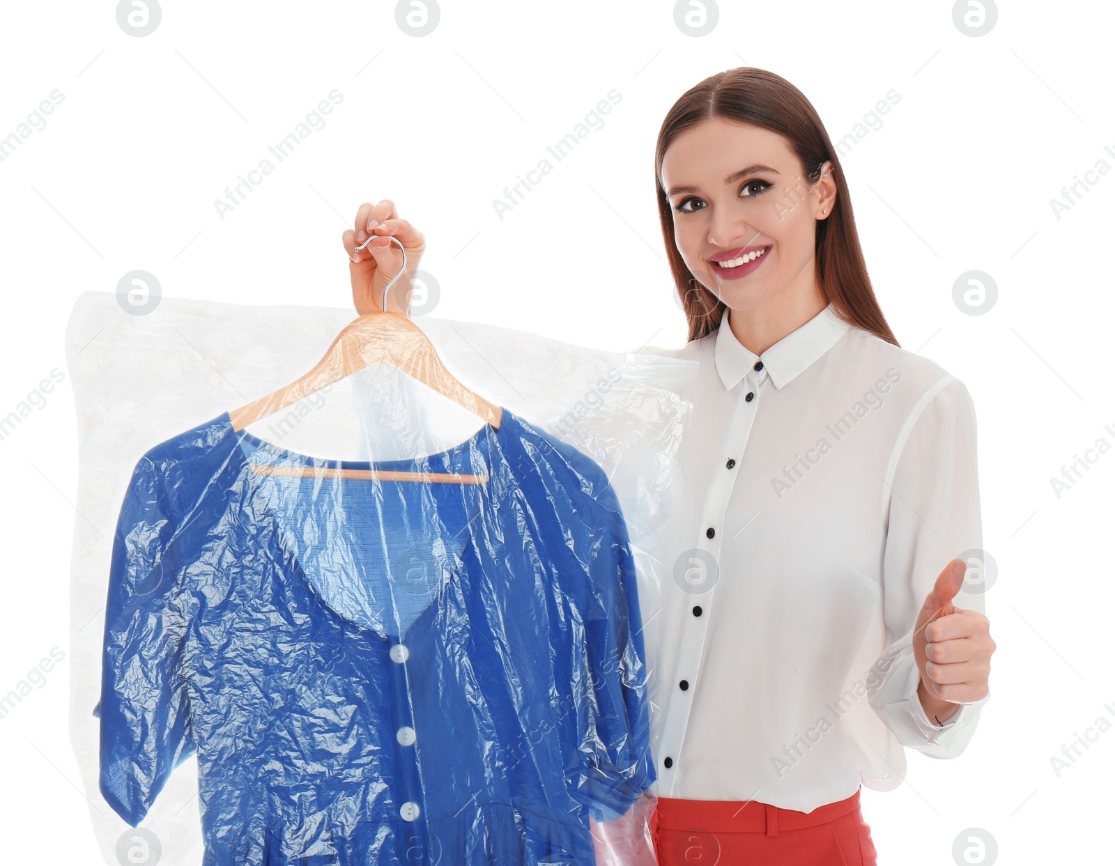 Photo of Young woman holding hanger with dress on white background. Dry-cleaning service