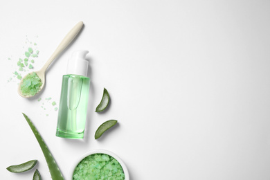 Flat lay composition with aloe vera and cosmetic products on white background