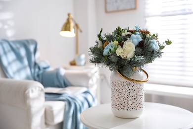 Photo of Beautiful wedding winter bouquet on table indoors. Space for text