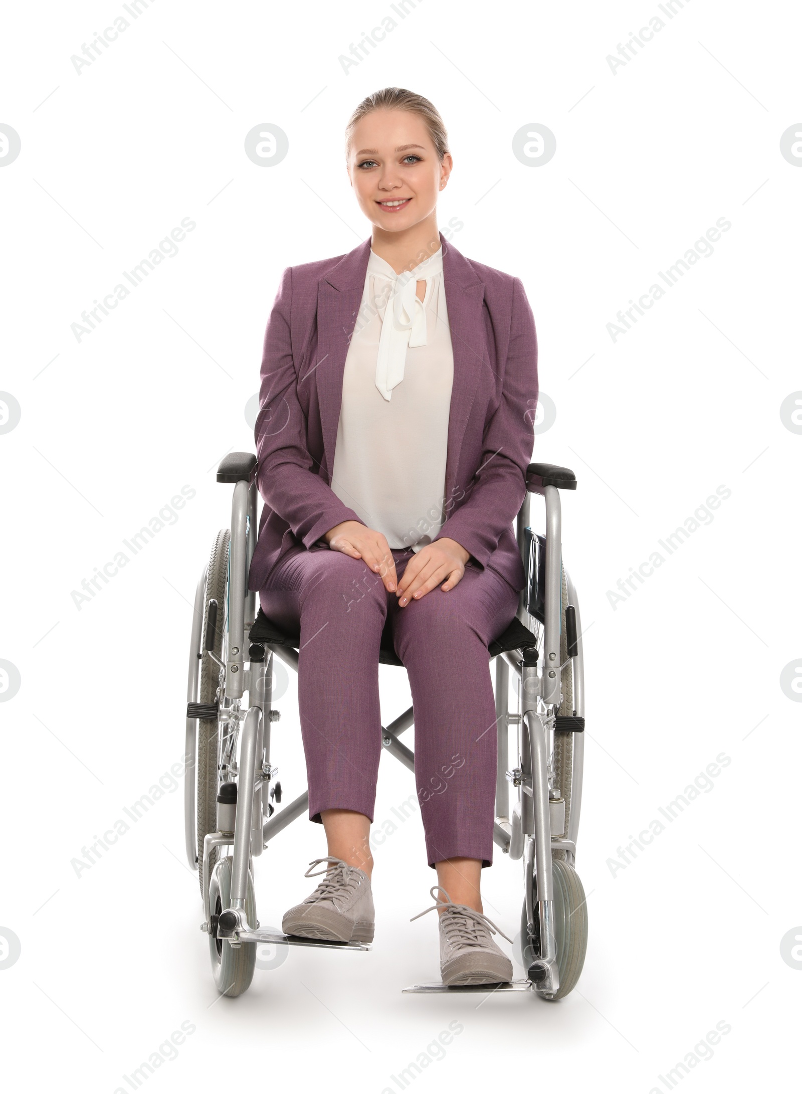 Photo of Beautiful young businesswoman in wheelchair isolated on white