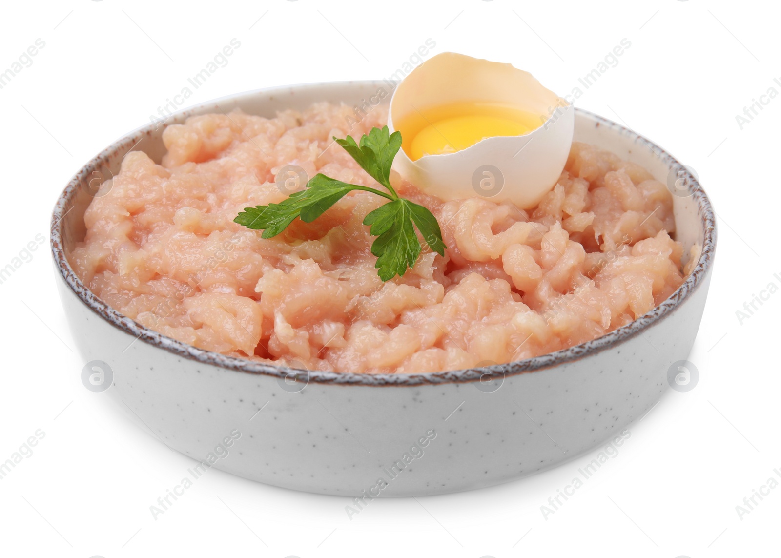 Photo of Fresh raw minced meat, parsley and egg in bowl isolated on white