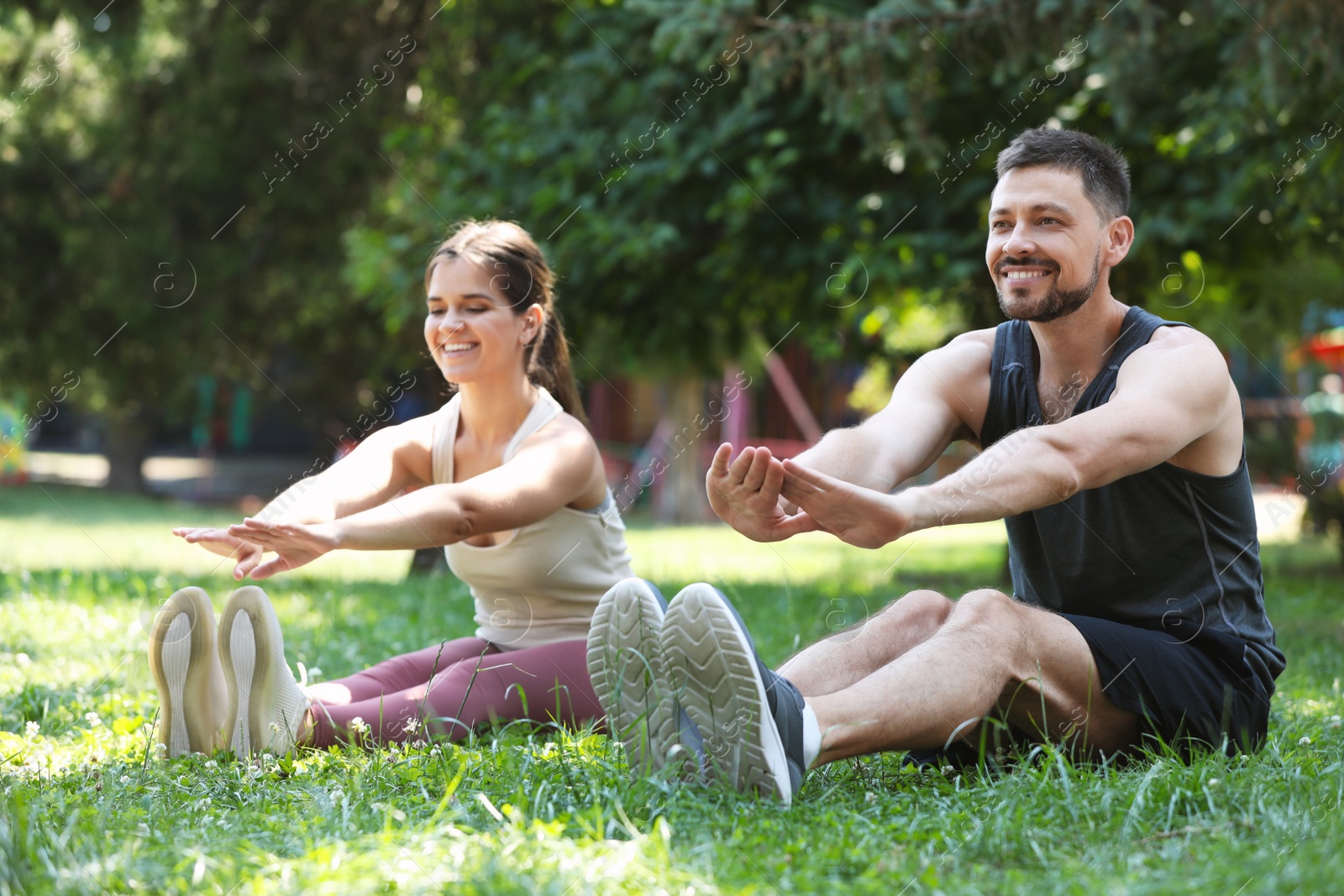 Photo of Man and woman doing morning exercise in park