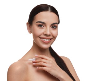 Photo of Young woman applying body cream onto her neck against white background