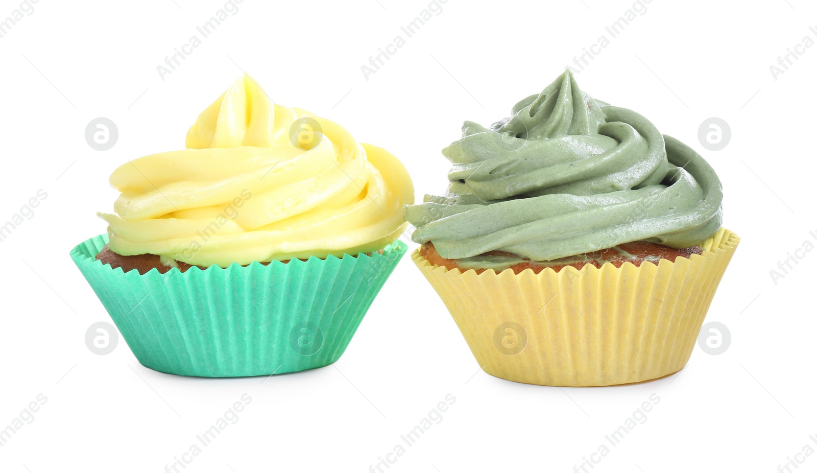 Photo of Different tasty cupcakes with cream isolated on white