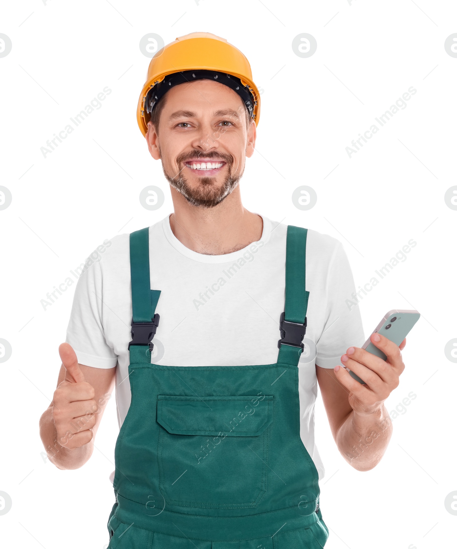 Photo of Professional repairman in uniform with phone on white background