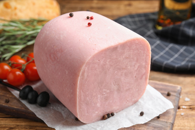 Piece of tasty fresh ham on table, closeup